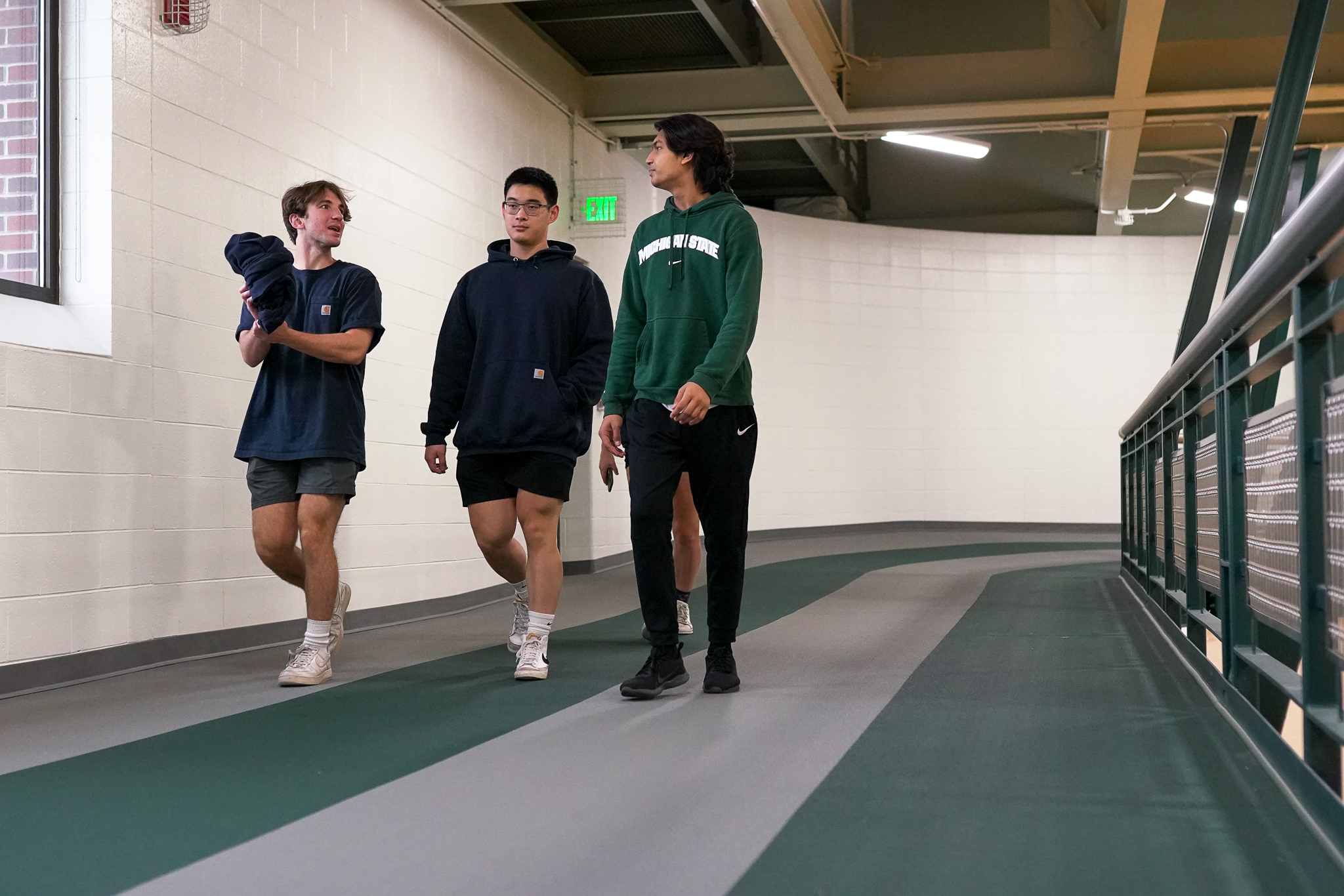 Students walking on indoor track