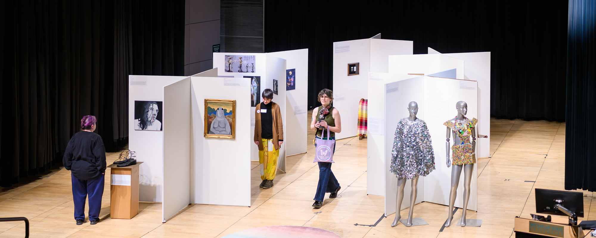 Art Showcase with attendees viewing the exhibits