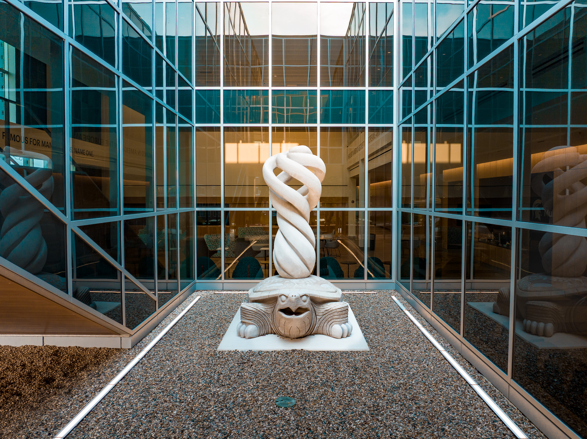The MCC sculpture sits in a light well inside the building