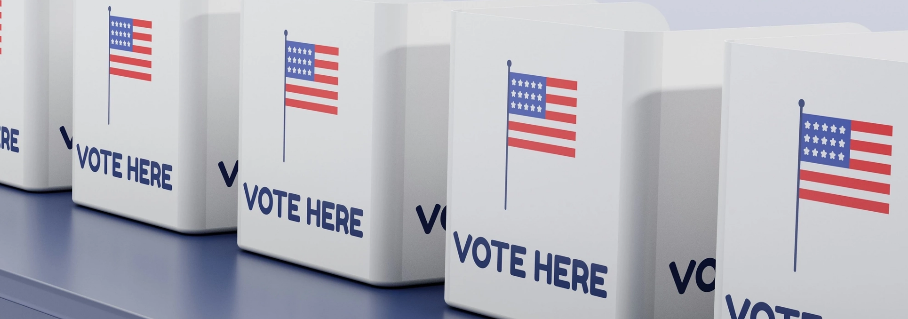 A row of voting boxes with a flag and "Vote Here" message