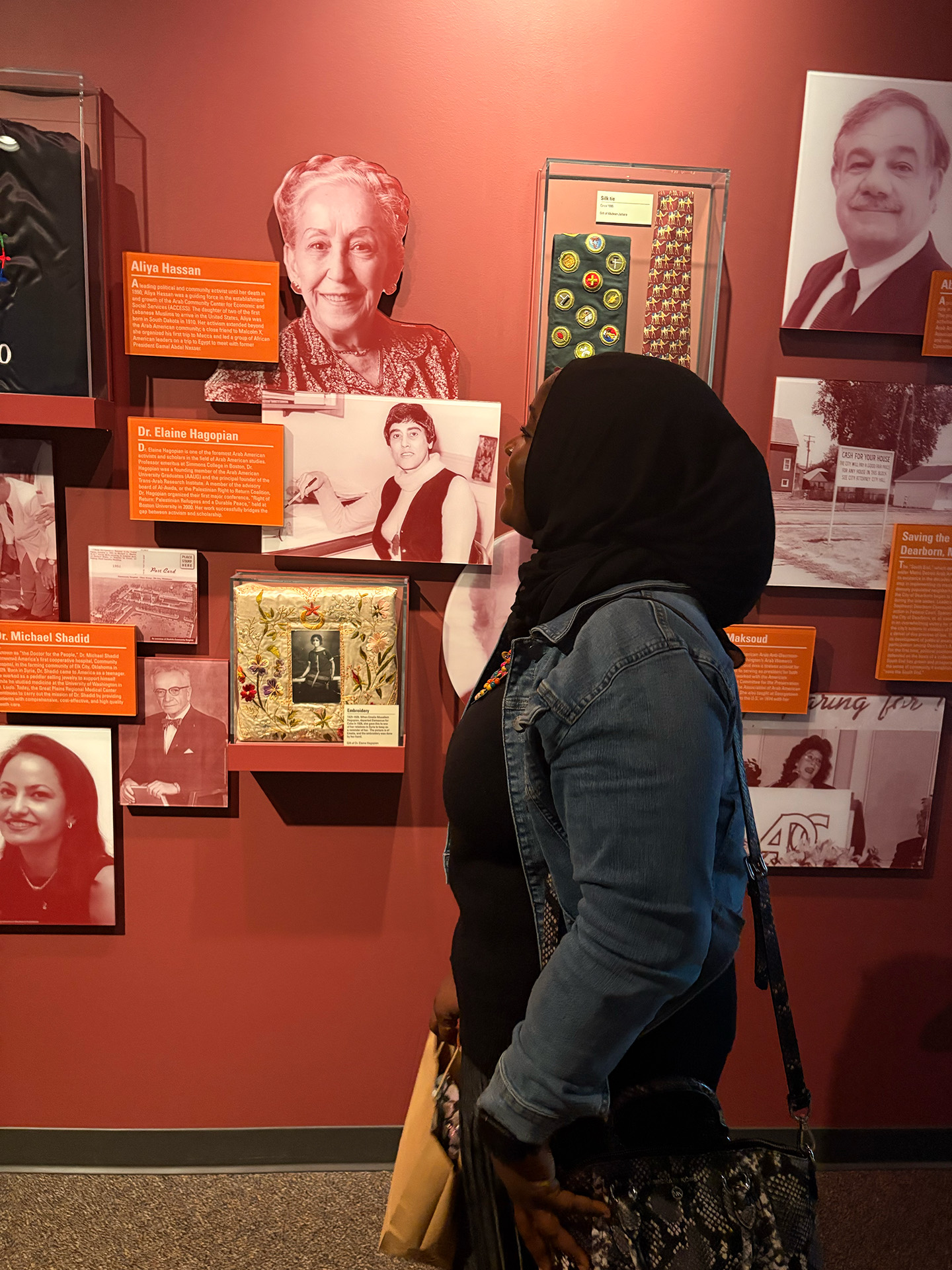 Student in the forground admiring an exhibit