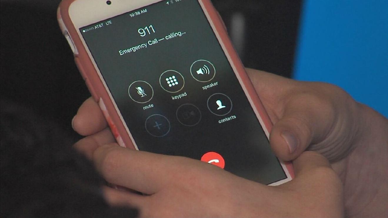 Phone and hands making emergency call