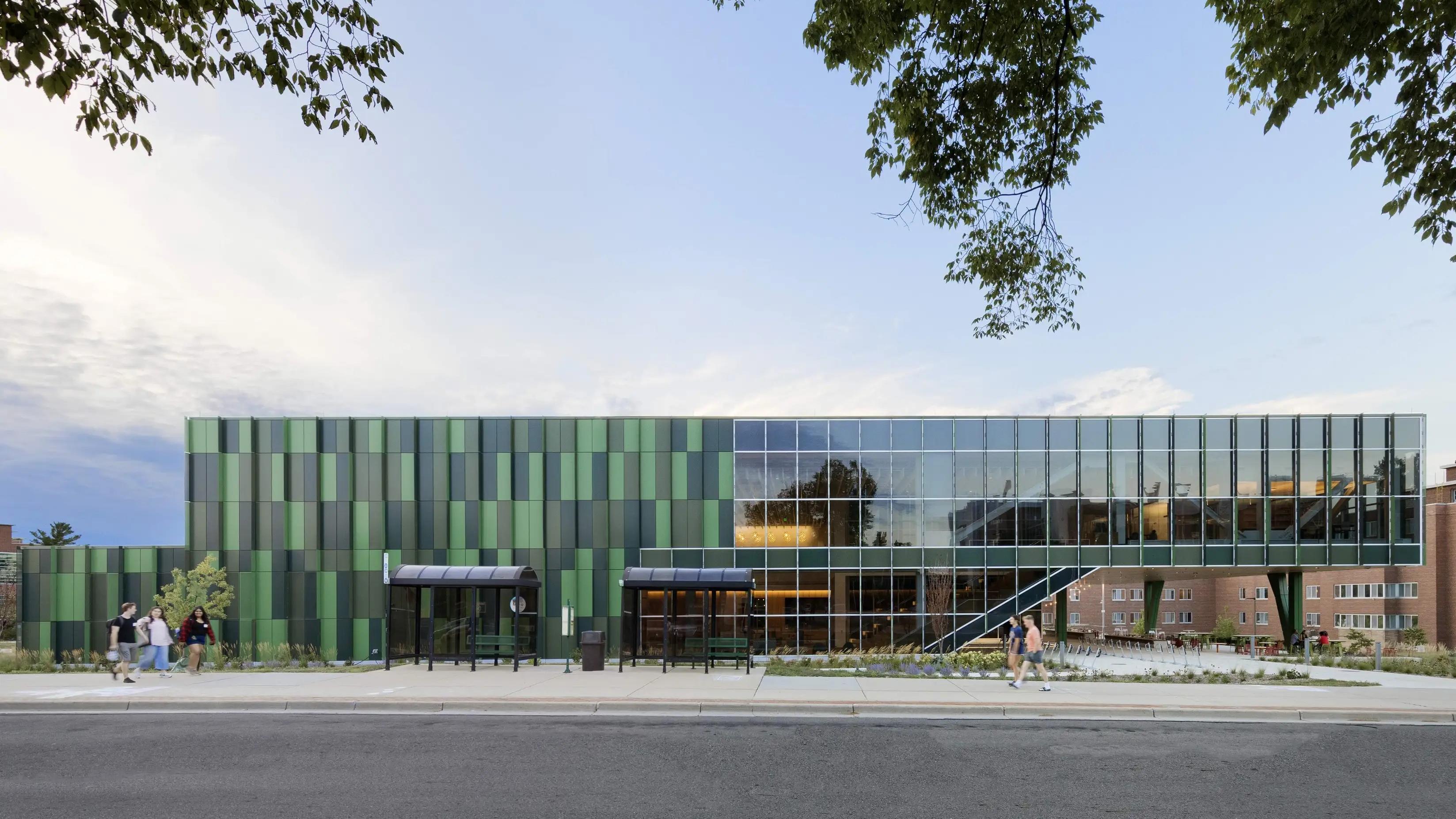 The Multicultural Center’s facade with students walking by